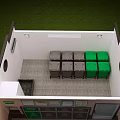 Indoor Waste Classification Facility With Gray And Green Trash Bins And Signs