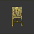 Golden Ornate Chair With Ancient Figural Motifs And Colorful Decorations