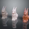 Three Decorative Rabbit Figurines Silver White Brown on Reflective Surface 3d model