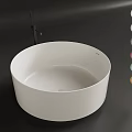 Modern White Freestanding Round Bathtub With Colorful Decorative Spheres On Dark Bathroom Surface