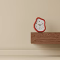 Irregular Shaped Red Frame White Dial Clock On Wooden Shelf Against Beige Wall 3d model