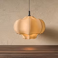 Elegant Petal Shaped Beige Fabric Pendant Light with Warm Lighting Against Textured Wall
