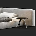 Single Bed With Modern Design Gray Mattress Striped Bedspread White Pillow And Small Round Table