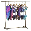 Swimwear On Hangers With Various Colors And Styles Displayed On Rack