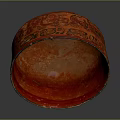 Red Carved Bowl Sculpture With Intricate Surface Texture And Smooth Curved Edges