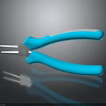 Blue Handle Pliers With Metal Jaws And Reflection On Black Surface
