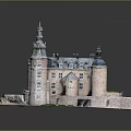 Historic Castle Architecture With Spired Towers Blue Roofs Stone Walls And Green Courtyard