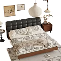 Elegant Double Bed with Black Leather Headboard Floral Bedding Nightstand Area Rug and Wall Art