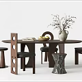 Round Wooden Dining Table Set With Modern Unique Chairs Vase Books And Fruit Bowl