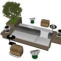Modern Public Chair Sofa Design With Neutral Tones Small Stools Side Tables And Green Plants