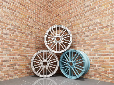 Three Silver And Blue Wheel Rims Leaning Against Brick Wall Corner On Gray Tiled Floor 3d model