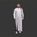 Man In White Thobe And Pink Ghutra Standing With Glasses On Gray Background
