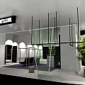 Modern Clothing Store Interior With Clothing Racks Glass Partitions And Green Plant