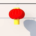 Red Lantern With Yellow Top And Bottom Gold Decorations Hanging On Black Pole