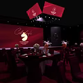 Elegant Event Venue Setup With Red Stage Backdrop Cafe Logo And Dining Tables