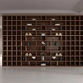 Large Grid Shelving Unit with Decorative Bowls Books and Ornaments Illuminated in Modern Bright Interior