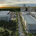 Multiple Industrial Warehouses With Green Landscaping Road Network And Sunset Sky