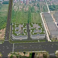 Aerial View Planning Of Twin Buildings With Green Roofs And Road Network