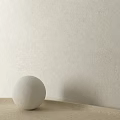Round White Stone Construction Component On Light Textured Wall Background