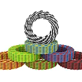 Colorful Woven Rings Stacked With Multiple Bright Colors And Intricate Patterns