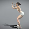 Woman Dancing with Hands Raised in Pink Tank Top White Shorts and Sneakers