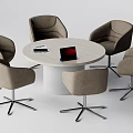 Modern Round Table And Upholstered Chairs Set With Laptop And Magazine On Top