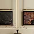 Abstract Paintings on Beige Wall with Metallic Frames and Decorative Vase with Thin Branches