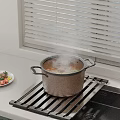 Steaming Pot on Metal Rack in Modern Kitchen Counter with Fresh Vegetable Plate
