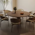 Modern Round Dining Table Set with Six Chairs Vase and Fruit Bowl on Wooden Floor