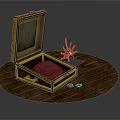 Open Golden Box With Red Cushion And Sun Shaped Ornament Decor Set On Round Tabletop