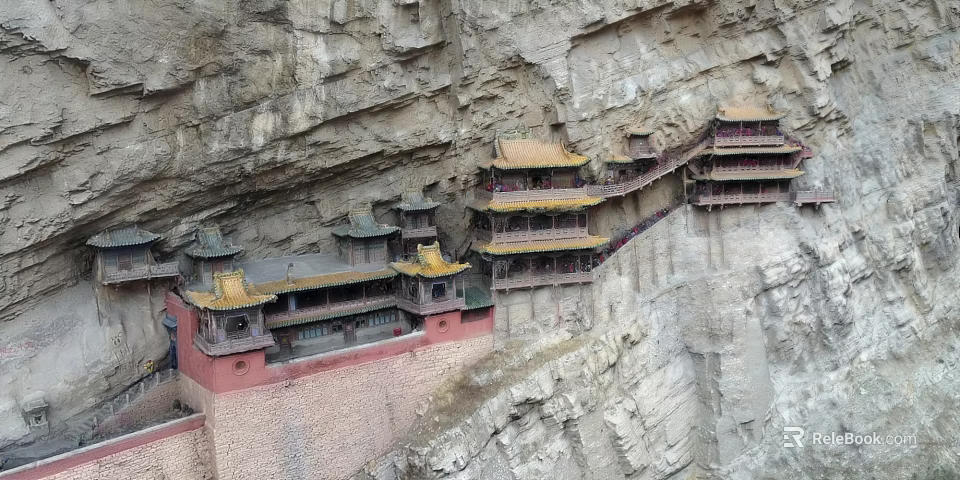 Ancient Architecture on Cliff Featuring Multi Story Structure and Yellow Roofs 3d model