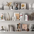 Stylish Decorative Ornament Combinations With Sculptures Vases Books Framed Art And Figurines On Multiple Shelves