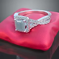 Elegant Silver Ring With Square Transparent Gemstone And Small Diamonds On Red Cushion 3d model