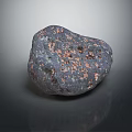 Natural Irregular Stone With Dark Surface And Copper Spots On Reflective Background