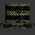 Black Cylindrical Commercial Equipment With Yellow Diagonal Stripes And Warning Signs On Circular Base