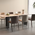 Modern Dining Table With Marble Top And Mixed Color Chairs Plus Decorative Vase In Bright Room