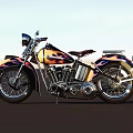 Vintage Yellow And Black Motorcycle With Flame Graphics On Open Road Under Sky