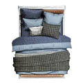 Double Bed In Cozy Bedroom With Upholstered Headboard Blue Plaid Bedding And Black Nightstands