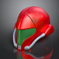 Red Metallic Helmet With Green Visor And Sleek Silver Accents