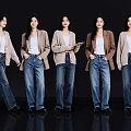 Group of Five Women Wearing Stylish Cardigans And Jeans Against Black Background