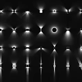 Illuminated Wall Lamps With Various Styles And Projected Light Effects On Black Background