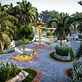 Tropical Park Landscape With Winding Pathways Circular Beds Palm Trees Yellow Accents And Lush Greenery