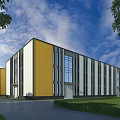 Modern Industrial Factory With Yellow White Exterior Large Glass Windows Green Lawn And Blue Sky