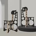 Pair Of Modern Accent Chairs With Geometric Cutouts And Black Wood Frame In Bright Room