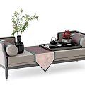 Elegant Modern Daybed with Decorative Pillows Tea Set and Potted Plants