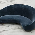 Navy Blue Curved Sectional Sofa With Velvet Upholstery And Gold Metal Legs On Marble Floor