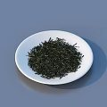 Different Colored Tea Leaves in White and Black Plates for Daily Use