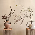 Rustic Striped and Minimalist Gray Vases with Dried Branches on Wooden Stumps Against Neutral Beige Wall