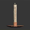 Decorative Copper Candlestick Holder With Curved Design And Lit White Candle