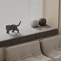 Beige Sectional Sofa in Living Room with Window Bench Cat Plush and Furry Ball Pillows